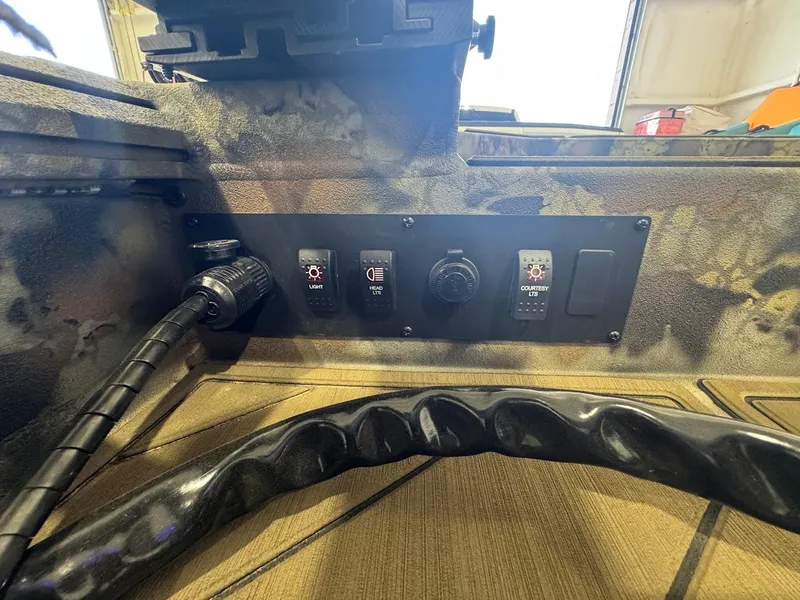 Slide: The Image of Control panel of 2025 Thor TIMBER HAMMER with switches and connectors in a rugged setting. - 13