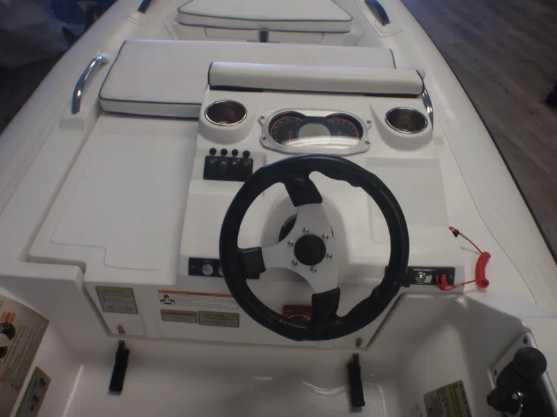 Slide: The Image of 2020 AB Inflatables ABJET 330 boat dashboard with steering wheel and control panel. - 2