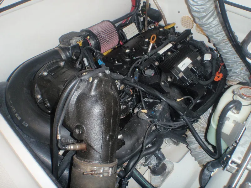Slide: The Image of Engine compartment of 2020 AB Inflatables ABJET 330, showcasing mechanical components and wiring. - 3
