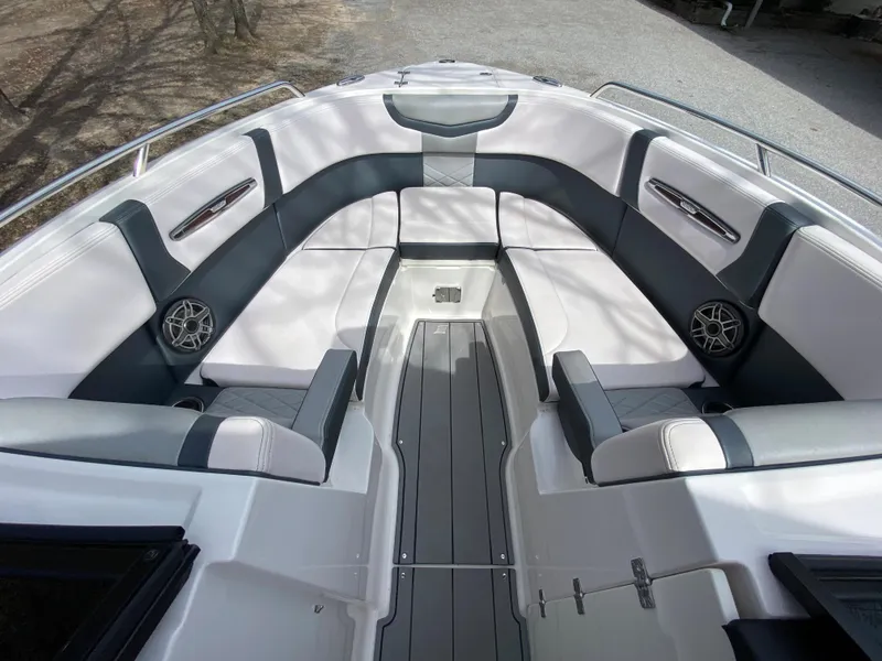 Slide: The Image of 2020 Chaparral 25 SURF boat interior with spacious seating and modern design. - 15