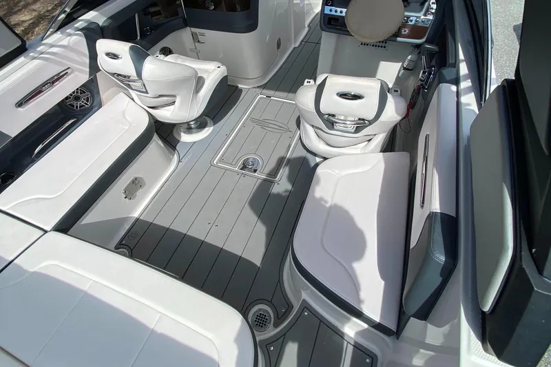 Slide: The Image of 2020 Chaparral 25 SURF boat interior with sleek seating and modern design. - 16