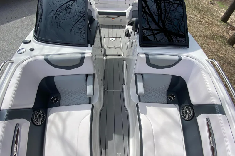 Slide: The Image of 2020 Chaparral 25 SURF boat interior with sleek seating and modern design. - 17