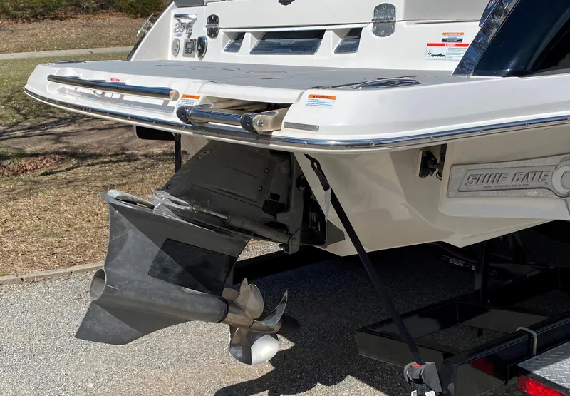 Slide: The Image of 2020 Chaparral 25 SURF boat stern with propeller and swim platform. - 6