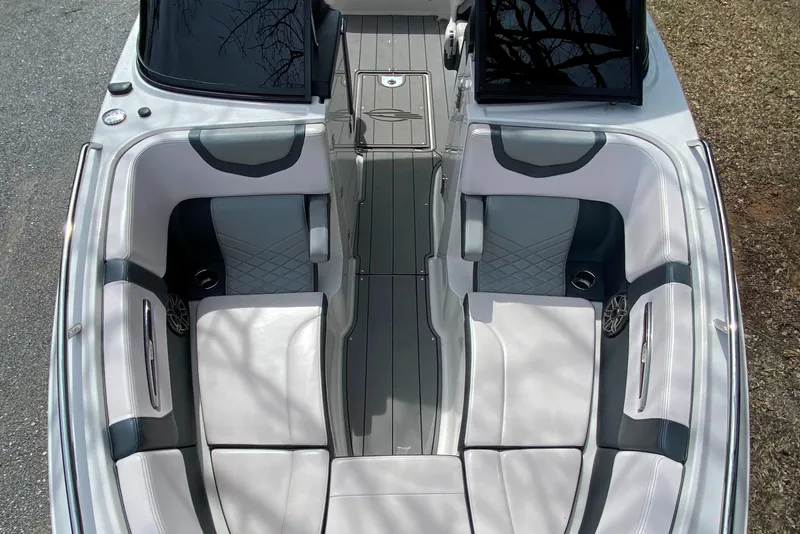 Slide: The Image of 2020 Chaparral 25 SURF boat interior with gray and white seating. - 8