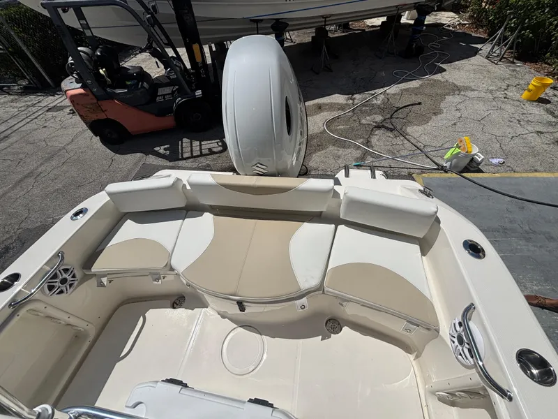 Slide: The Image of 2025 Bulls Bay 200 Center Console boat interior with seating and storage compartments. - 17