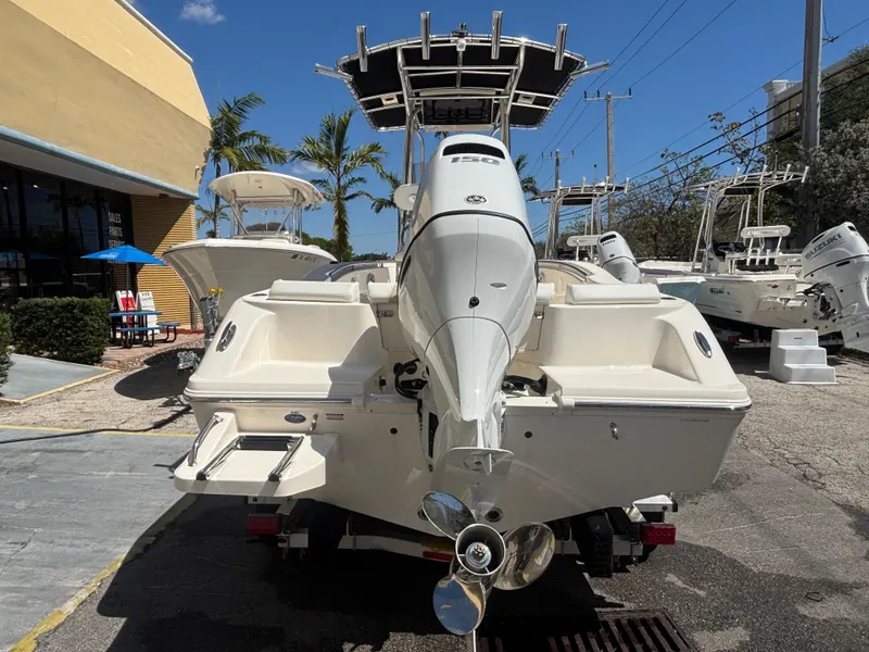 Slide: The Image of 2025 Bulls Bay 200 Center Console boat, rear view, displayed outdoors under clear sky. - 4