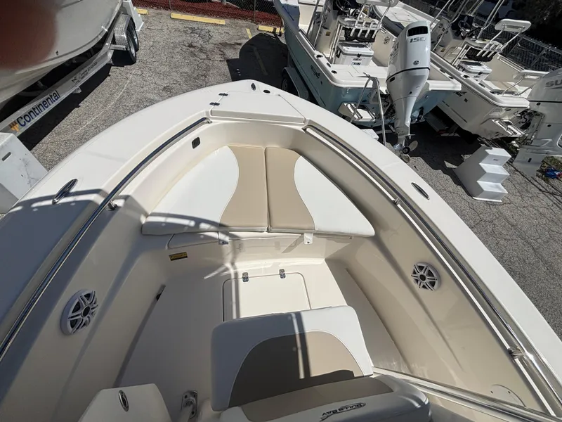 Slide: The Image of 2025 Bulls Bay 200 Center Console boat interior with seating and storage compartments. - 8