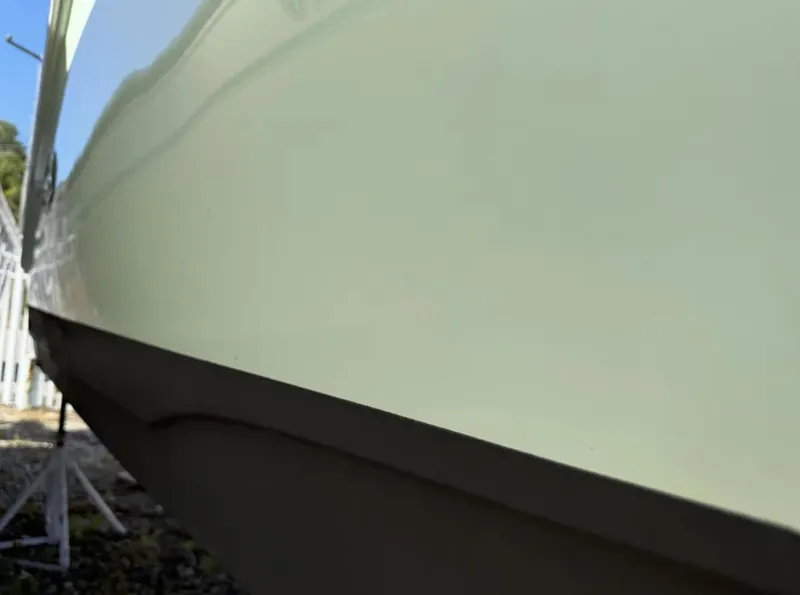 Slide: The Image of 2021 Sea Hunt Gamefish 30 boat hull, close-up view, showcasing sleek design and craftsmanship. - 12