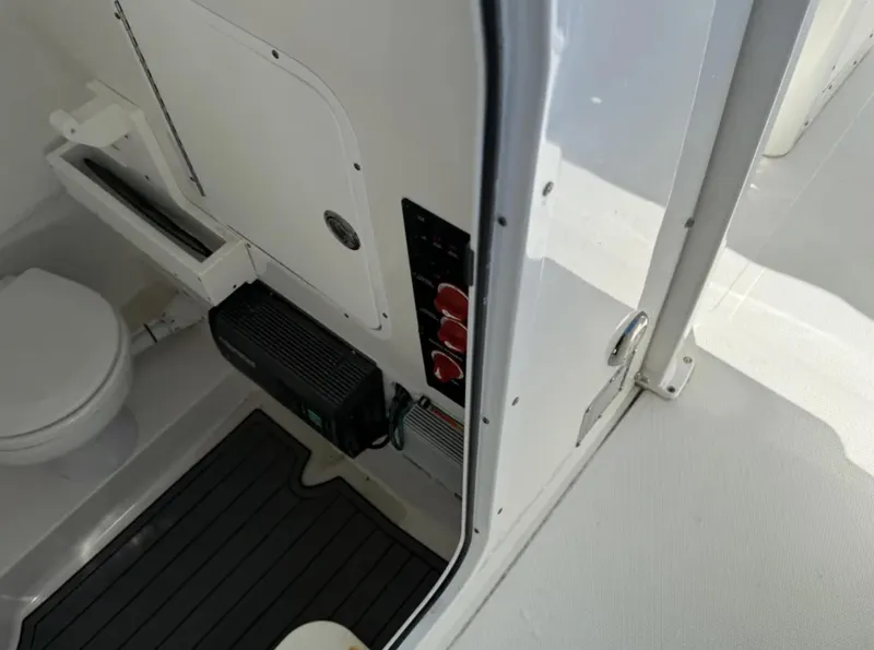 Slide: The Image of 2021 Sea Hunt Gamefish 30 interior with toilet and control panel. - 20