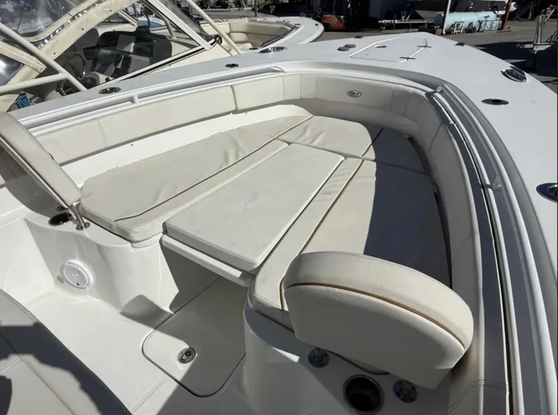 Slide: The Image of 2021 Sea Hunt Gamefish 30 Forward Seating, white cushioned boat interior. - 21