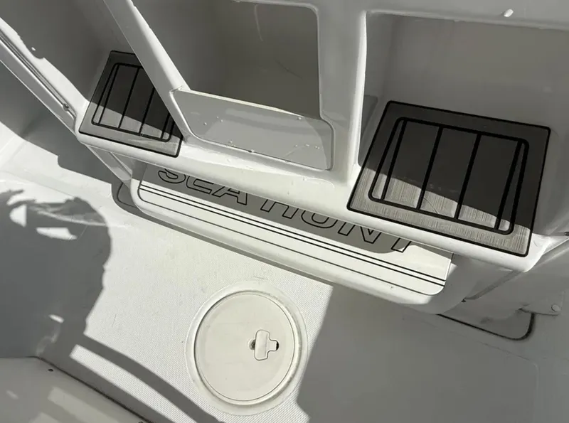 Slide: The Image of 2021 Sea Hunt Gamefish 30 boat deck with storage compartments and Sea Hunt branding. - 23
