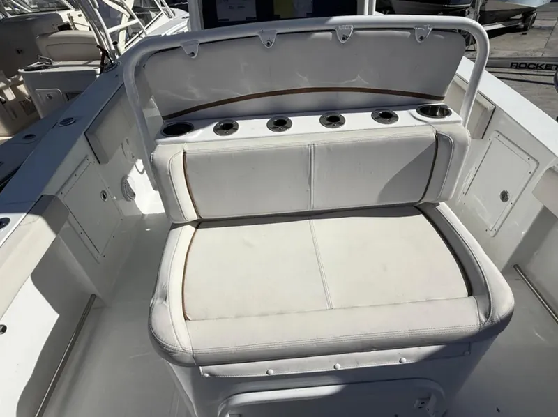 Slide: The Image of 2021 Sea Hunt Gamefish 30 Forward Seating, white cushioned bench with rod holders. - 27