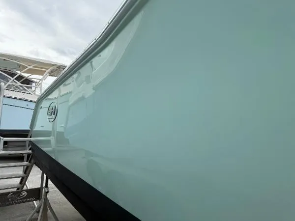 Slide: The Image of 2021 Sea Hunt Gamefish 30 Forward Seating boat, side view with sleek design. - 36