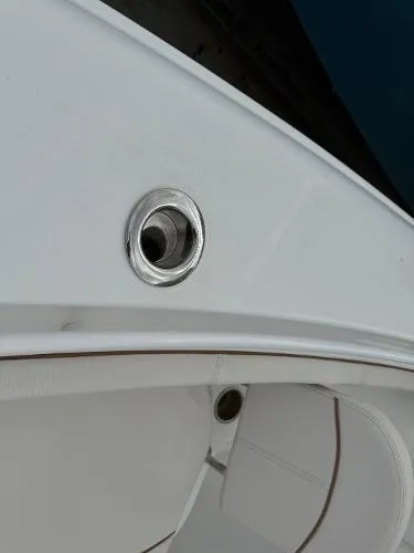 Slide: The Image of 2021 Sea Hunt Gamefish 30 Forward Seating boat detail, featuring sleek white design and stainless steel fittings. - 41