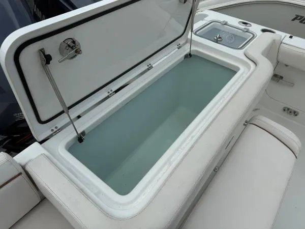 Slide: The Image of 2021 Sea Hunt Gamefish 30 Forward Seating boat with open storage compartment. - 44