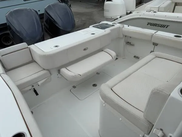 Slide: The Image of 2021 Sea Hunt Gamefish 30 Forward Seating, spacious interior with cushioned seating and dual outboard motors. - 45