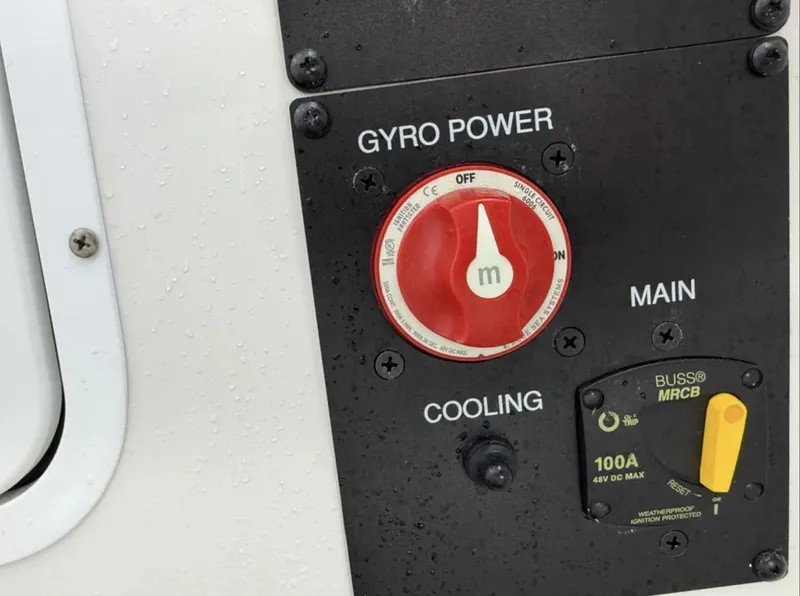 Slide: The Image of Control panel of 2021 Sea Hunt Gamefish 30, featuring gyro power and cooling switches. - 8