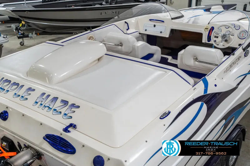 Slide: The Image of 2001 Eliminator 26 Daytona speedboat with custom "Purple Haze" design in showroom. - 14
