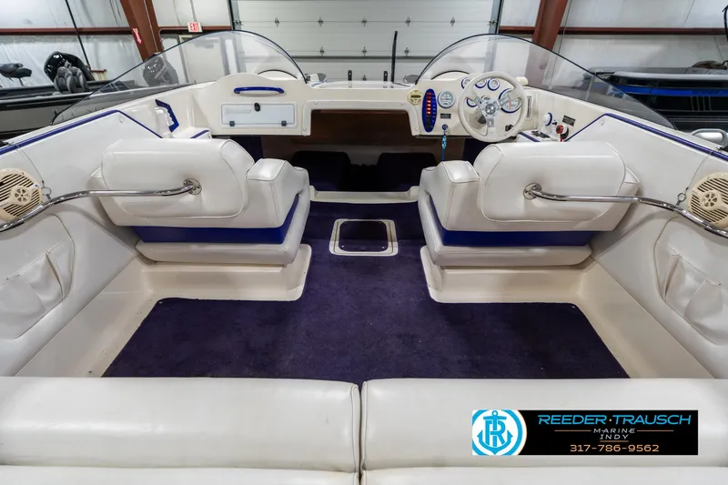 Slide: The Image of 2001 Eliminator 26 Daytona boat interior with white seats and purple carpet. - 16