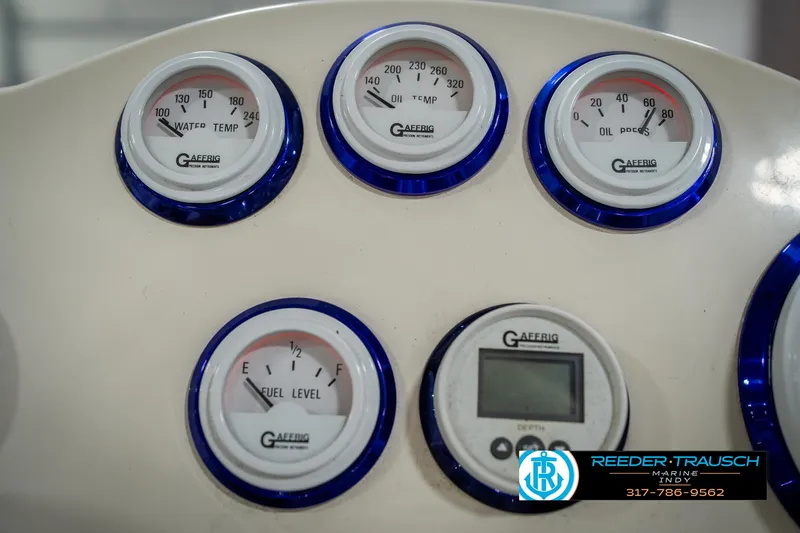 Slide: The Image of Dashboard gauges of a 2001 Eliminator 26 Daytona boat, featuring fuel, temperature, and oil indicators. - 27