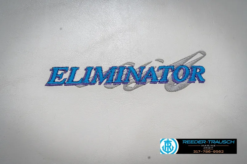Slide: The Image of Eliminator 26 Daytona 2001 logo on white background with Reeder-Trausch Marine branding. - 32
