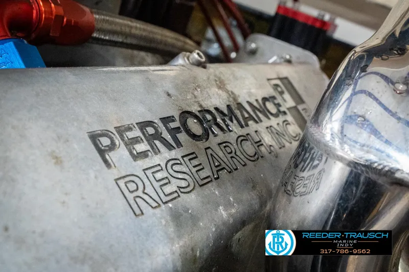 Slide: The Image of Close-up of a 2001 Eliminator 26 Daytona engine with Performance Research Inc. branding. - 36