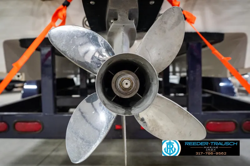 Slide: The Image of Propeller of 2001 Eliminator 26 Daytona boat on trailer, secured with orange straps. - 40
