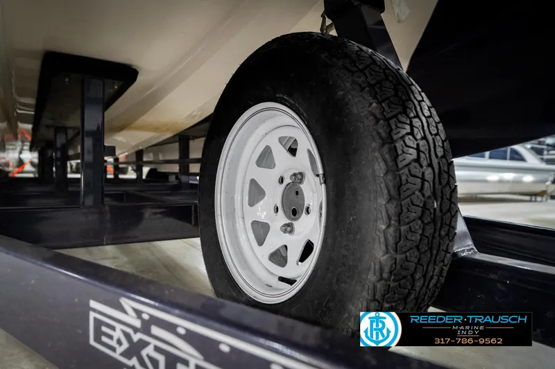 Slide: The Image of Trailer wheel of a 2001 Eliminator 26 Daytona boat on display. - 44
