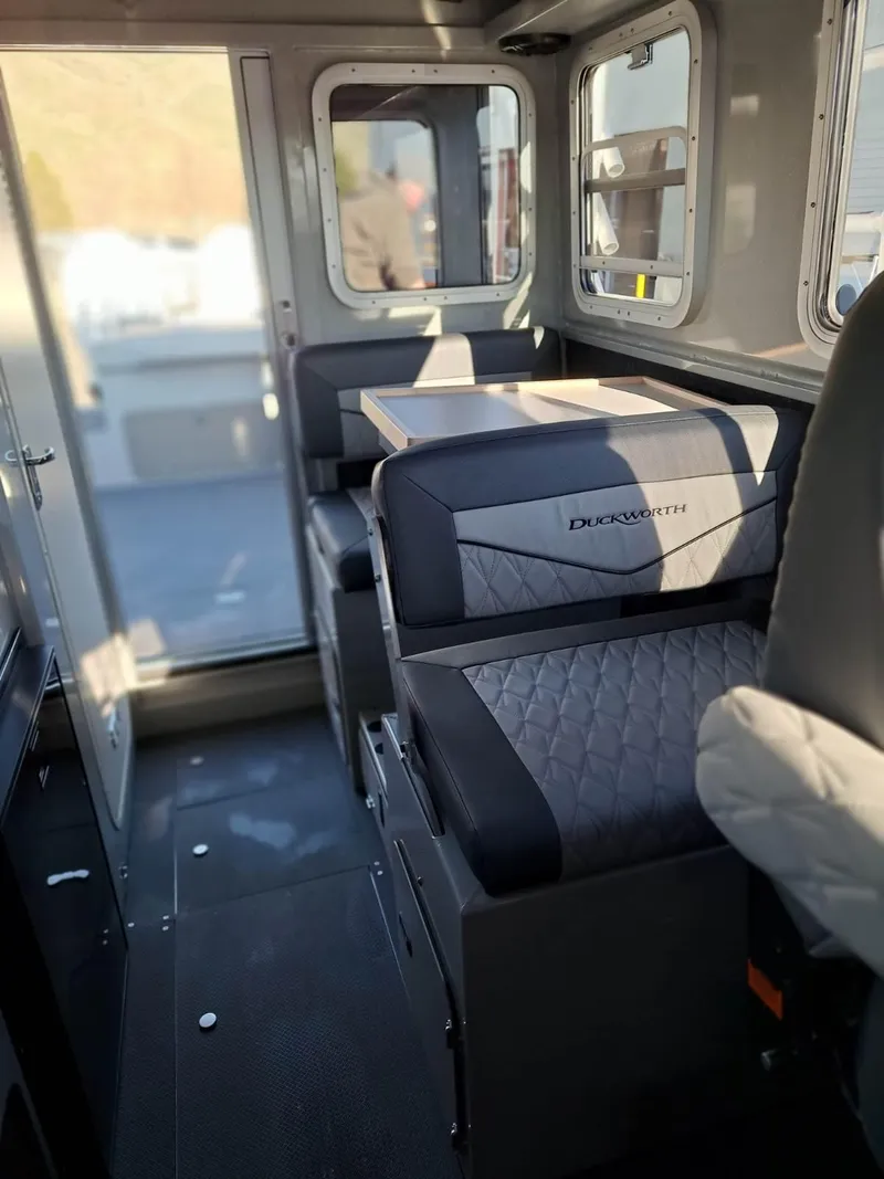 Slide: The Image of Interior of 2025 Duckworth 28 Offshore boat with seating and table. - 3