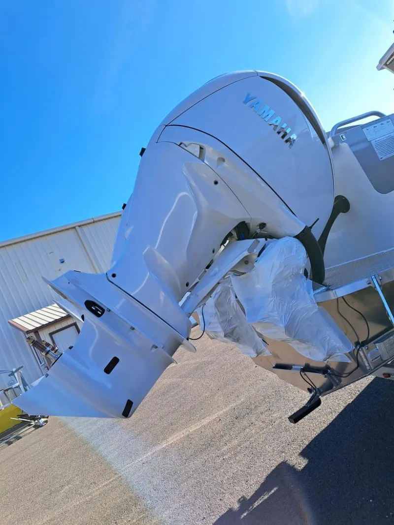 Slide: The Image of 2025 Duckworth 28 Offshore boat with Yamaha outboard motor in a sunny outdoor setting. - 9