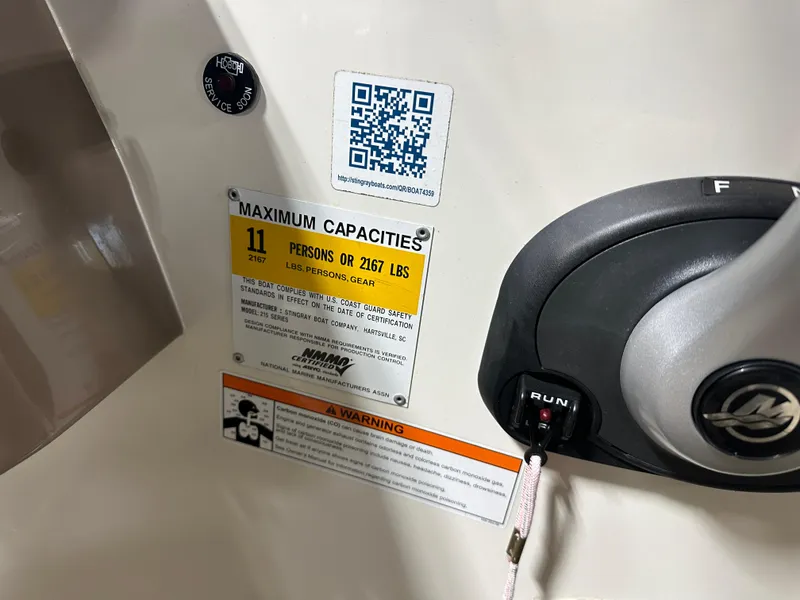 Slide: The Image of 2015 Stingray 215 LR boat capacity label, showing maximum 11 persons or 2167 lbs. - 10
