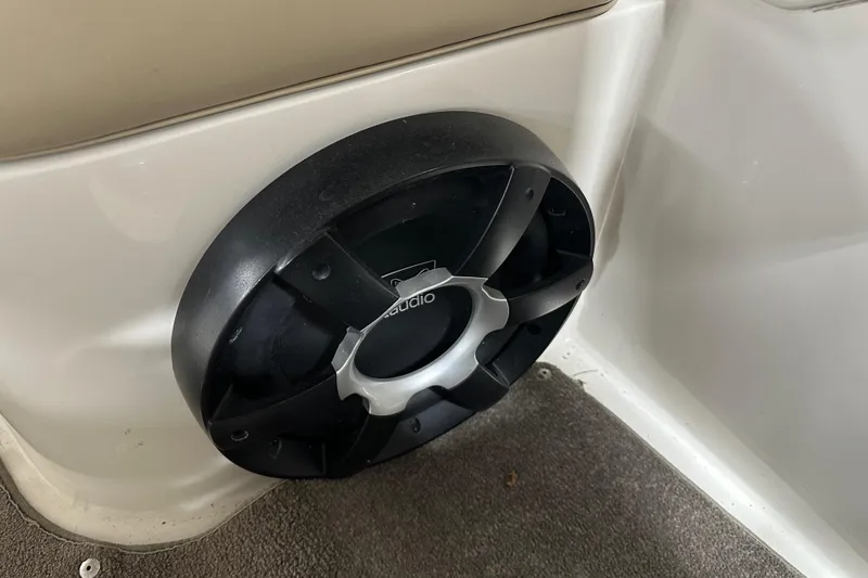 Slide: The Image of Speaker installed in a 2015 Stingray 215 LR boat interior. - 17
