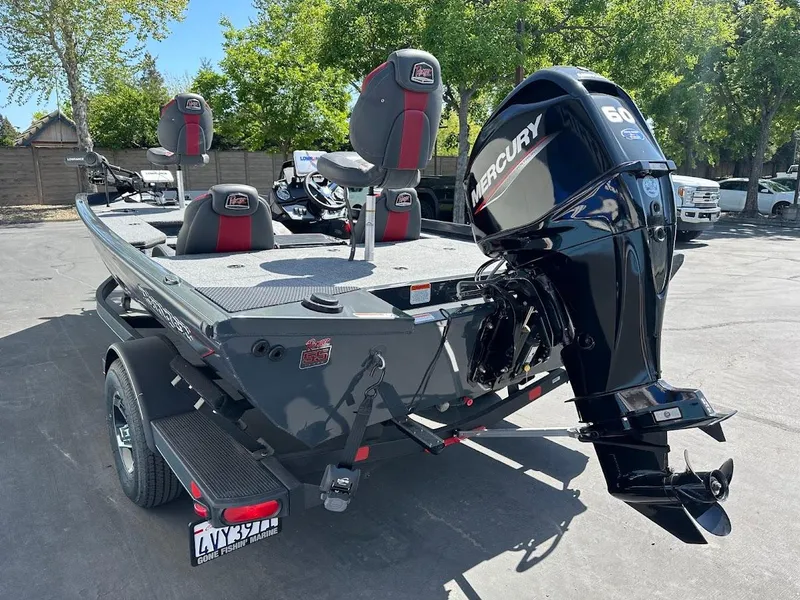 Slide: The Image of 2023 Ranger RT178 boat with Mercury 60 engine, parked outdoors. - 17
