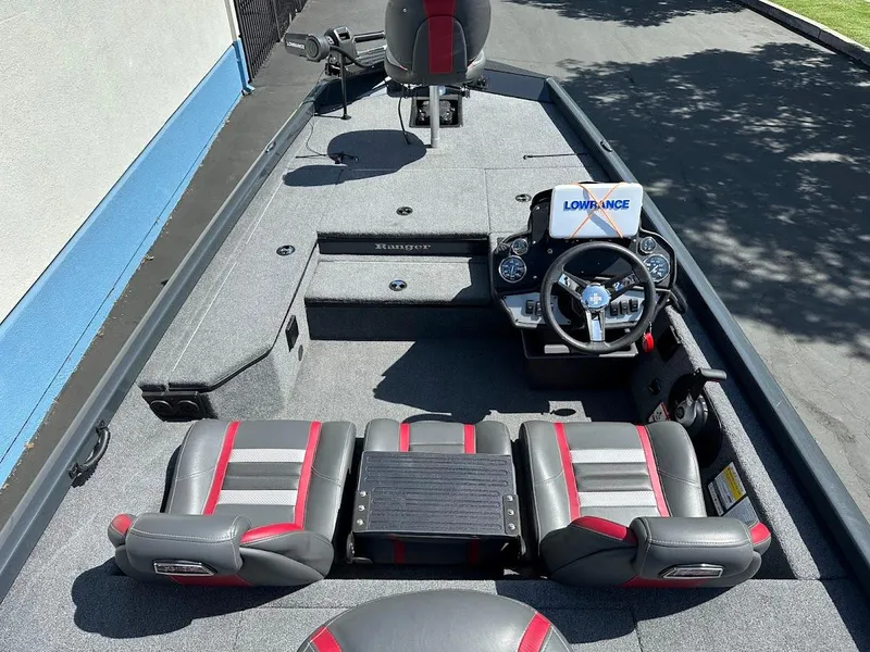 Slide: The Image of 2023 Ranger RT178 boat interior with steering console and seating. - 19