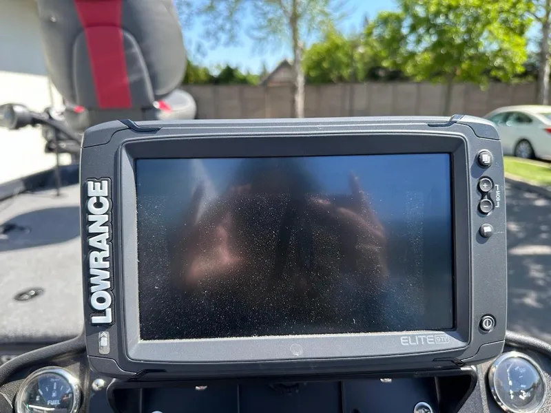 Slide: The Image of Lowrance Elite fish finder on 2023 Ranger RT178 boat dashboard, sunny day background. - 22