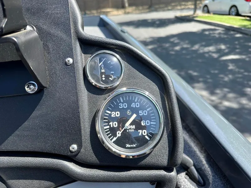 Slide: The Image of Dashboard of 2023 Ranger RT178 boat showing RPM and fuel gauges. - 24