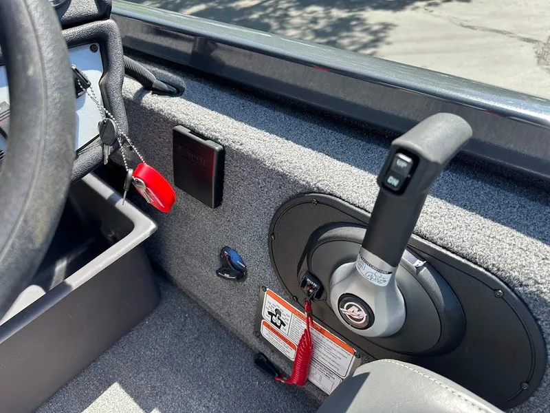 Slide: The Image of 2023 Ranger RT178 boat interior with steering wheel and control panel. - 25