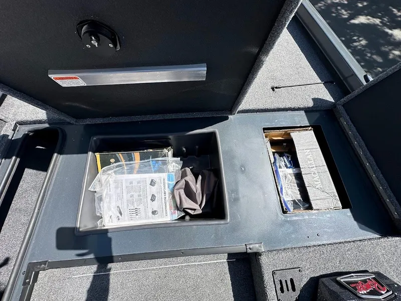 Slide: The Image of 2023 Ranger RT178 storage compartments with organized gear and accessories. - 34