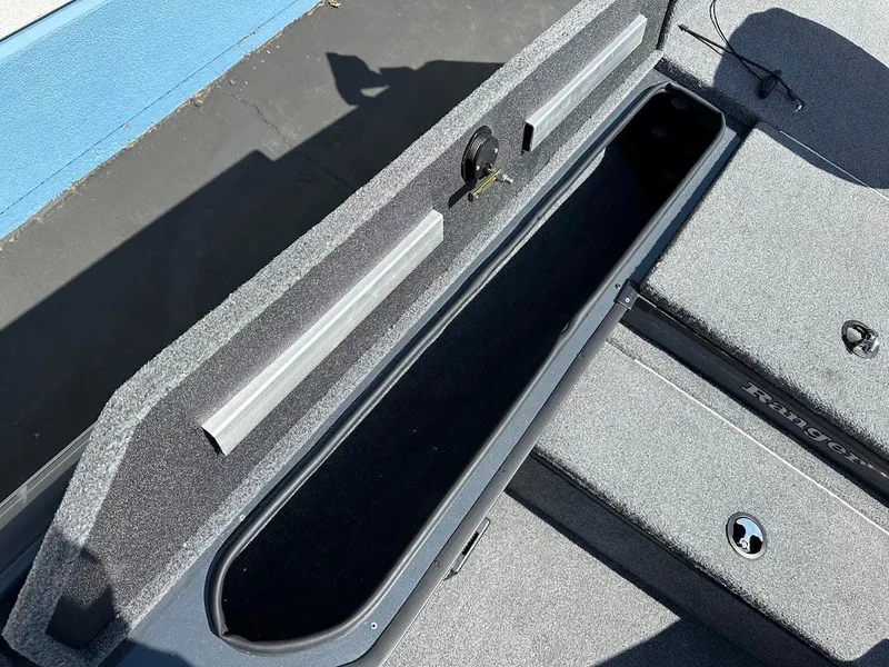 Slide: The Image of 2023 Ranger RT178 boat storage compartment with open lid, showcasing interior space and design. - 35