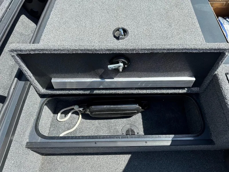 Slide: The Image of 2023 Ranger RT178 storage compartment with lock and interior view. - 36