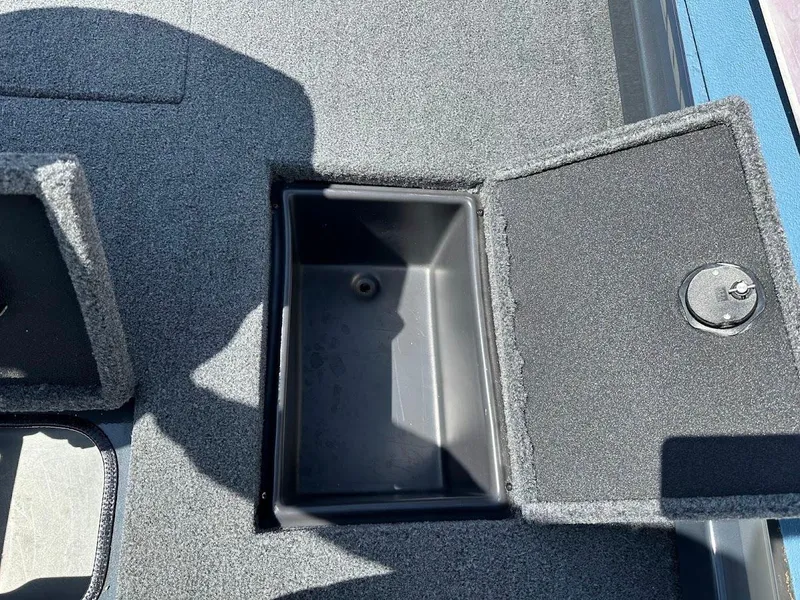 Slide: The Image of 2023 Ranger RT178 boat storage compartment with open lid, showing interior details. - 41