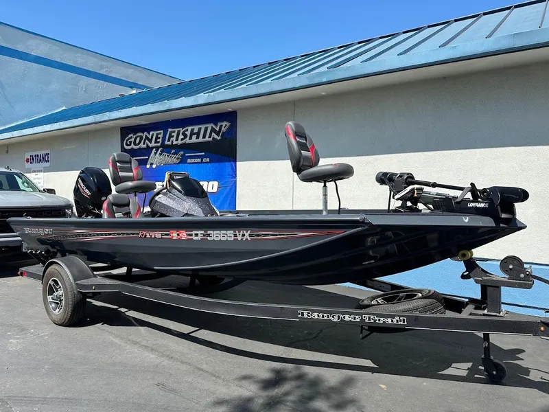 Slide: The Image of 2023 Ranger RT178 fishing boat on trailer outside a store. - 7