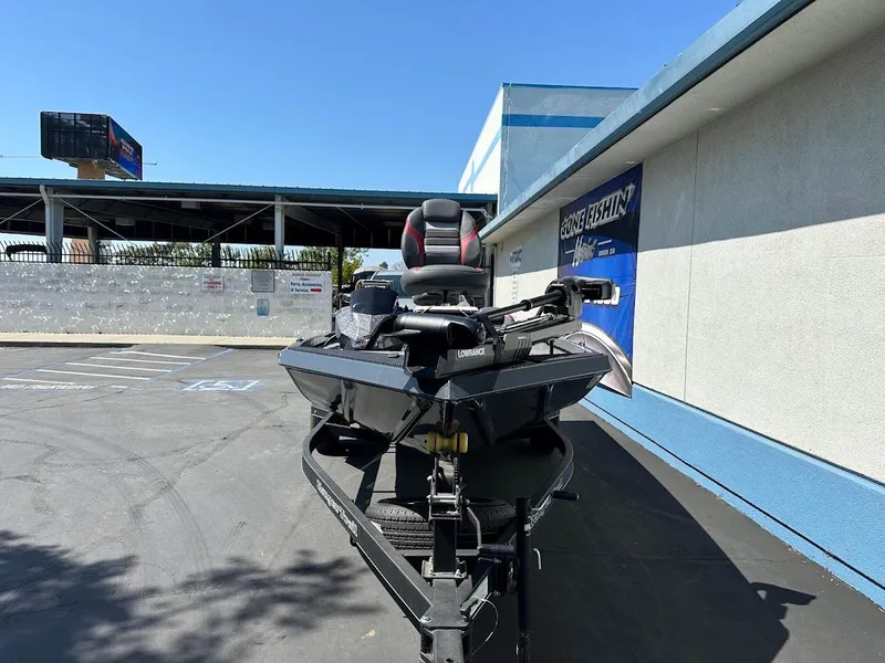 Slide: The Image of 2023 Ranger RT178 boat parked outside a building on a sunny day. - 8