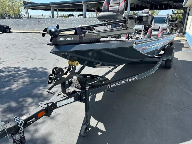 Slide: The Image of 2023 Ranger RT178 fishing boat on trailer with Lowrance equipment, parked outdoors. - 9