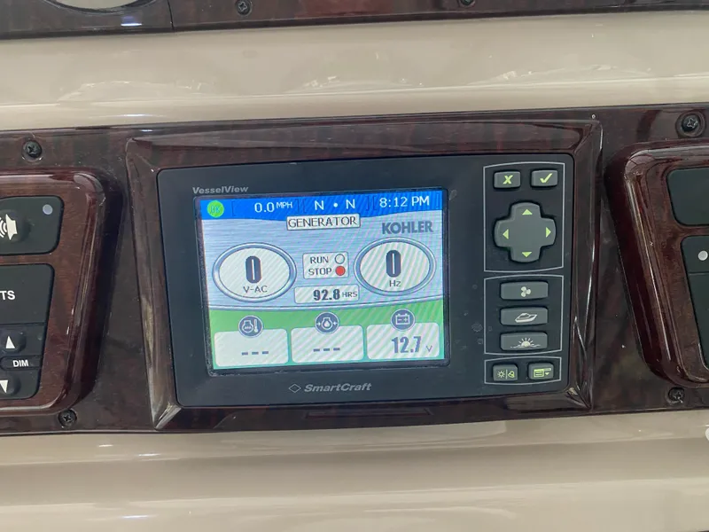 Slide: The Image of SmartCraft display on 2009 Sea Ray 350 Sundancer showing generator status and controls. - 25