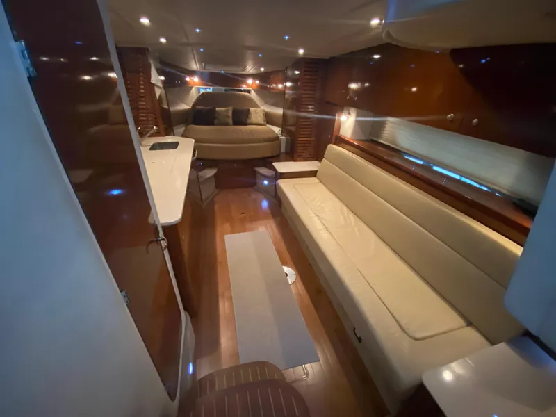 Slide: The Image of Luxurious interior of 2009 Sea Ray 350 Sundancer yacht with elegant seating and ambient lighting. - 31