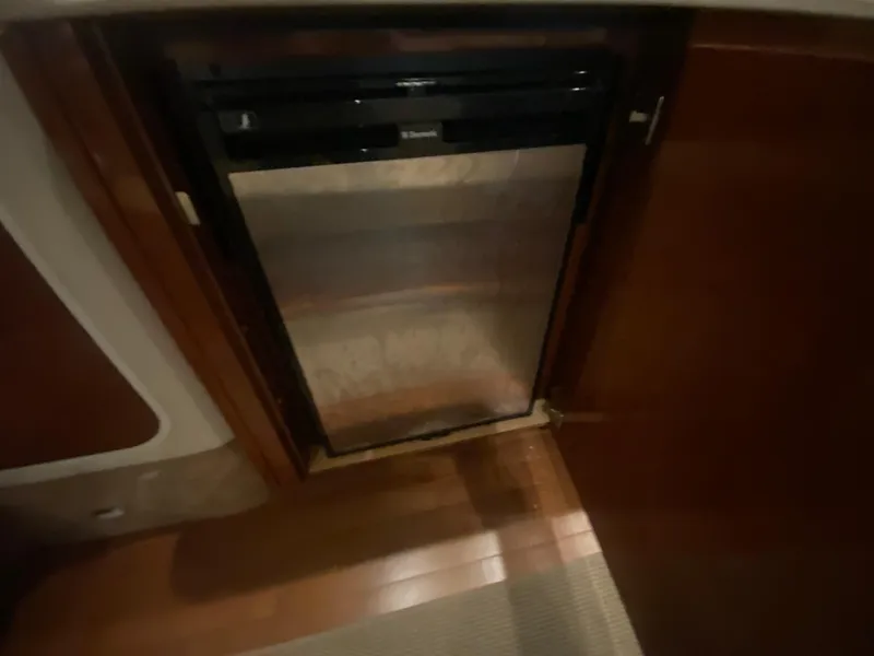 Slide: The Image of Compact refrigerator in 2009 Sea Ray 350 Sundancer yacht interior. - 34