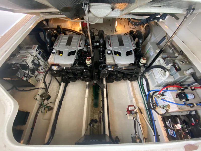 Slide: The Image of Engine room of 2009 Sea Ray 350 Sundancer with dual engines and mechanical components. - 46
