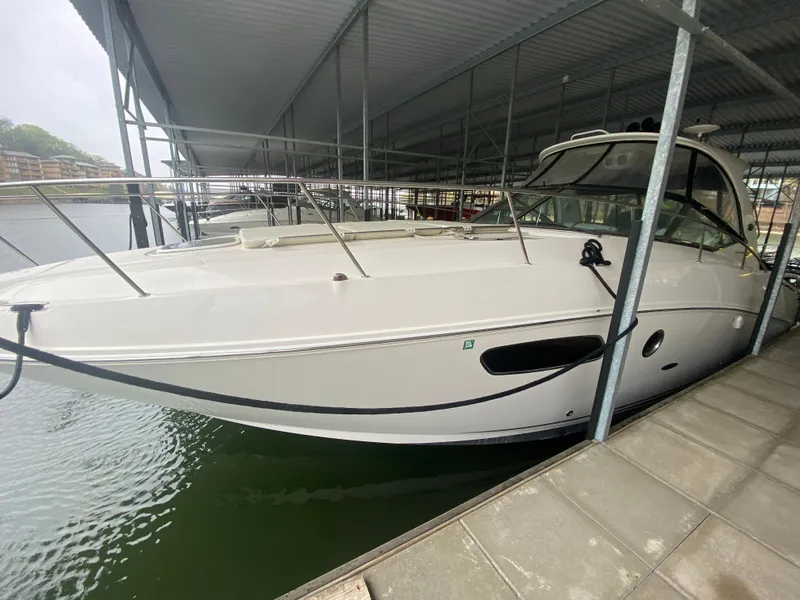 Slide: The Image of 2009 Sea Ray 350 Sundancer docked under a covered marina. - 5