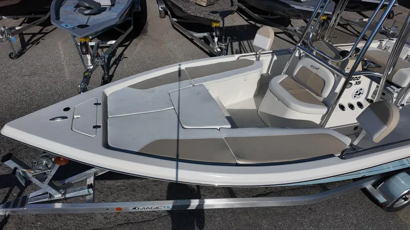Slide: The Image of 2025 Bulls Bay 2200XS boat on trailer, featuring spacious seating and sleek design. - 26